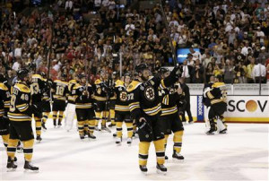 Boston Bruins' Patrice Bergeron (C) leads his team in saluting the ...