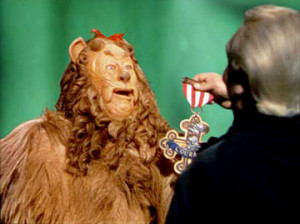 Bert Lahr as the Cowardly Lion receives his courage award from Frank ...