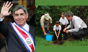 Costa Rican President Oscar Arias shoveled dirt onto the roots of an ...