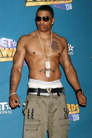 Another singer who's forgotten his shirt; in Nelly's defence he has a ...