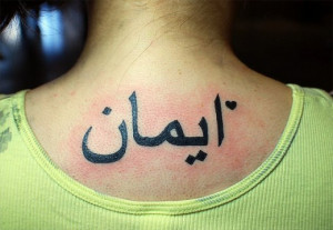 the Arabic Script Tattoo and meaning on upper back for girl