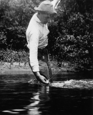 young Ernest Hemingway fishes in Michigan, 1916.