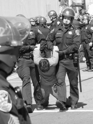 Anti-war activist arrested in San Francisco during the March 2003 ...