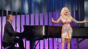 by NBC, singer Dolly Parton, right, performs as Robert Greenblatt ...