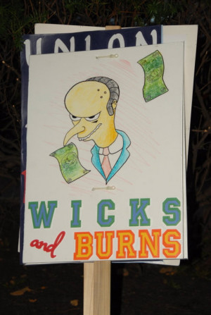 An OEA employee protest sign: OEA Exec. Director Larry Wicks was paid ...