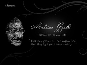Motivational Wallpaper Quote by Mahatma Gandhi: First they ignore you ...