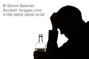 ... Silhouette of a Depressed Man Struggling With His Alcohol Addiction