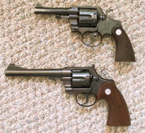 Bottom gun is a Colt Officer's Model Match