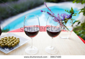 stock-photo-wine-glasses-at-the-pool-relaxing-scene-38617480.jpg