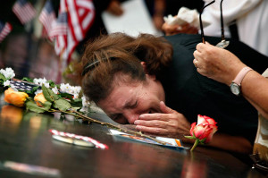 woman mourns the loss of her son at the World Trade Center Memorial ...