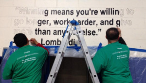 Comcast Cares Day volunteers painted inspirational quotes on the gym ...