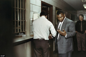 Locked up: Tyson is pictured getting fingerprinted after being ...