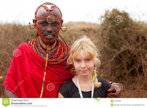 AFRICA, KENYA, MASAI MARA - JULY 2: Male tribal member wearing t ...