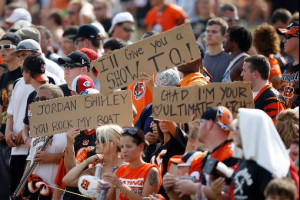 Bengals Fans Hold Signs...