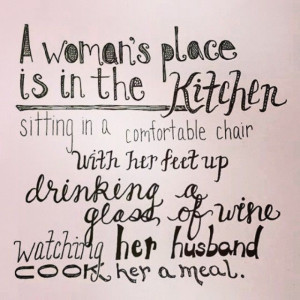 woman's place is in the kitchen sitting in a comfortable chair with ...