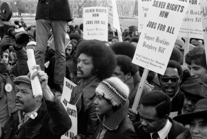 Jackson surrounded by marchers carrying signs advocating support for ...