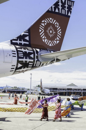 Women of Fiji Airways and Yasawa wrap the just-arrived aircraft with ...