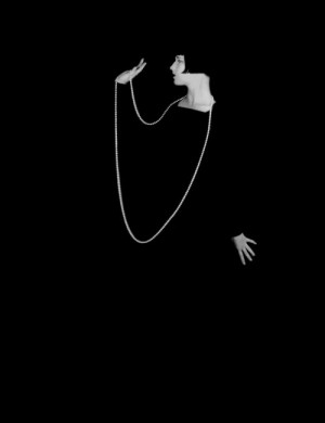 ... necklace against a black background. — Photo by Eugene Robert Richee