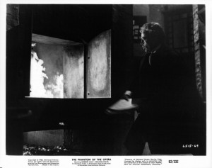 Herbert Lom throwing documents into fire in a scene from the film 'The ...