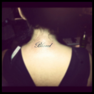 this quote tattoo on the back of her neck reads blessed and is inked ...