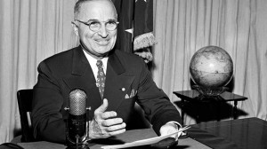 FILE Sept. 1, 1945: President Harry Truman sits before a microphone at ...
