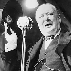 Shows a black and white photograph of Winston Churchill delivering a ...