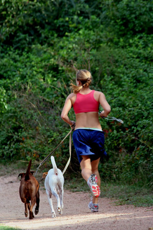 The author running with her two dogs.