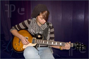 Girl Playing Electric Guitar At Concert Overall, my magazine would