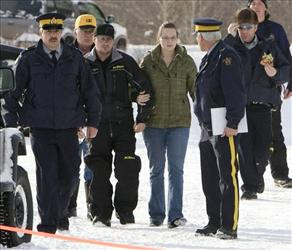 Avalanche survivor Jeff Adams, third from left, walks with his wife ...