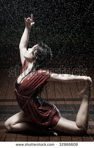 girl in red dancing in the rain