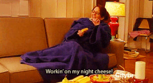 Liz Lemon eats cheese in bed. She sings about night cheese. And ...