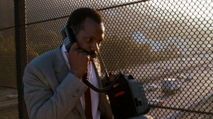 Danny Glover as Roger Murtaugh on a mobile phone in 