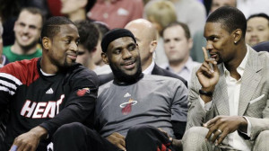 From left, Miami Heat's Dwyane Wade, LeBron James and Chris Bosh joke ...