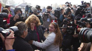 Family members react to the news that the drilling effort has reached ...