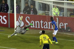 Brazil's goalie Jefferson tries to save a goal scored by Colombia's ...