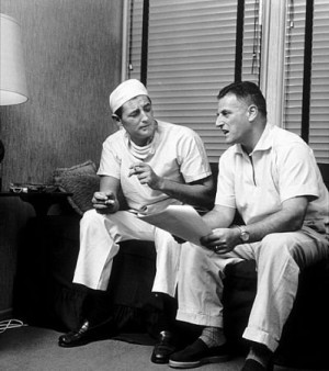 Stanley Kramer, director, and Robert Mitchum on the set of