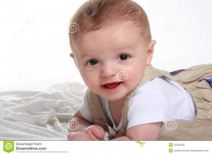... baby boy infant with brown eyes, lying on belly with white background