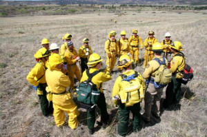 discuss wildland firefighting techniques at the Fort Carson Wildland ...