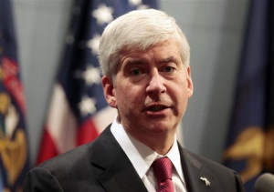 Michigan Governor Rick Snyder holds a news conference to talk about ...