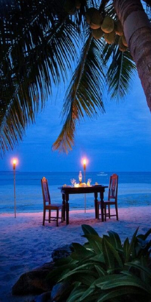 Candlelight and sunset on an exotic beach