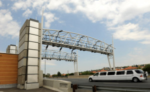 motor vehicle passes through an e-toll gantry. Sapa