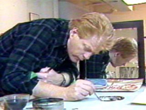 Artist Red Grooms works on a self-portrait.