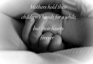 Mothers hold their children's hands