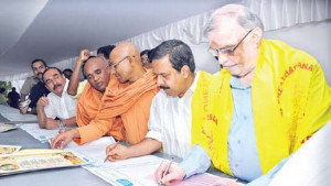 Governor P Sathasivam and Home Minister Ramesh Chennithala copying ...