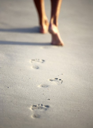 Footprints in the sand, barefoot, bare feet, beach, summer.