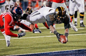Missouri running back Henry Josey (20) dives into the end zone for a ...