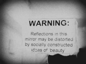 ... this mirror may be distorted by socially constructed ideas of beauty
