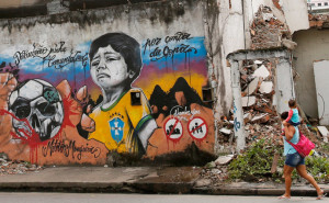 public bus drives over a graffiti referencing the 2014 World Cup in ...