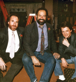 Sam Weisman Gary David Goldberg and actor Michael J Fox in the late