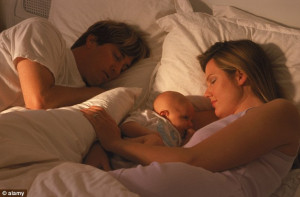 Three's a crowd: Sleeping with your baby can drive a wedge between ...